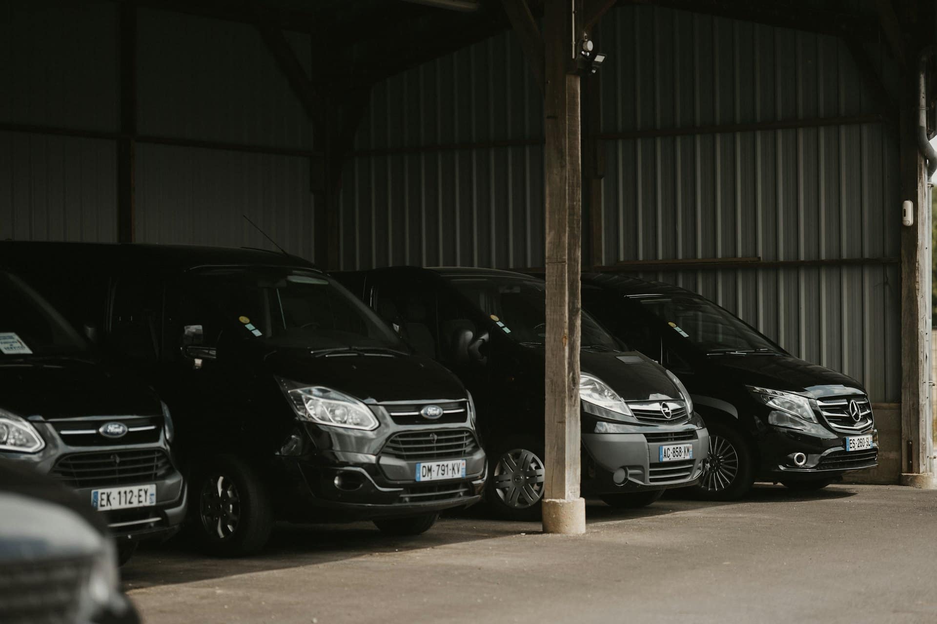Four work vehicles representing a settled business fleet facility